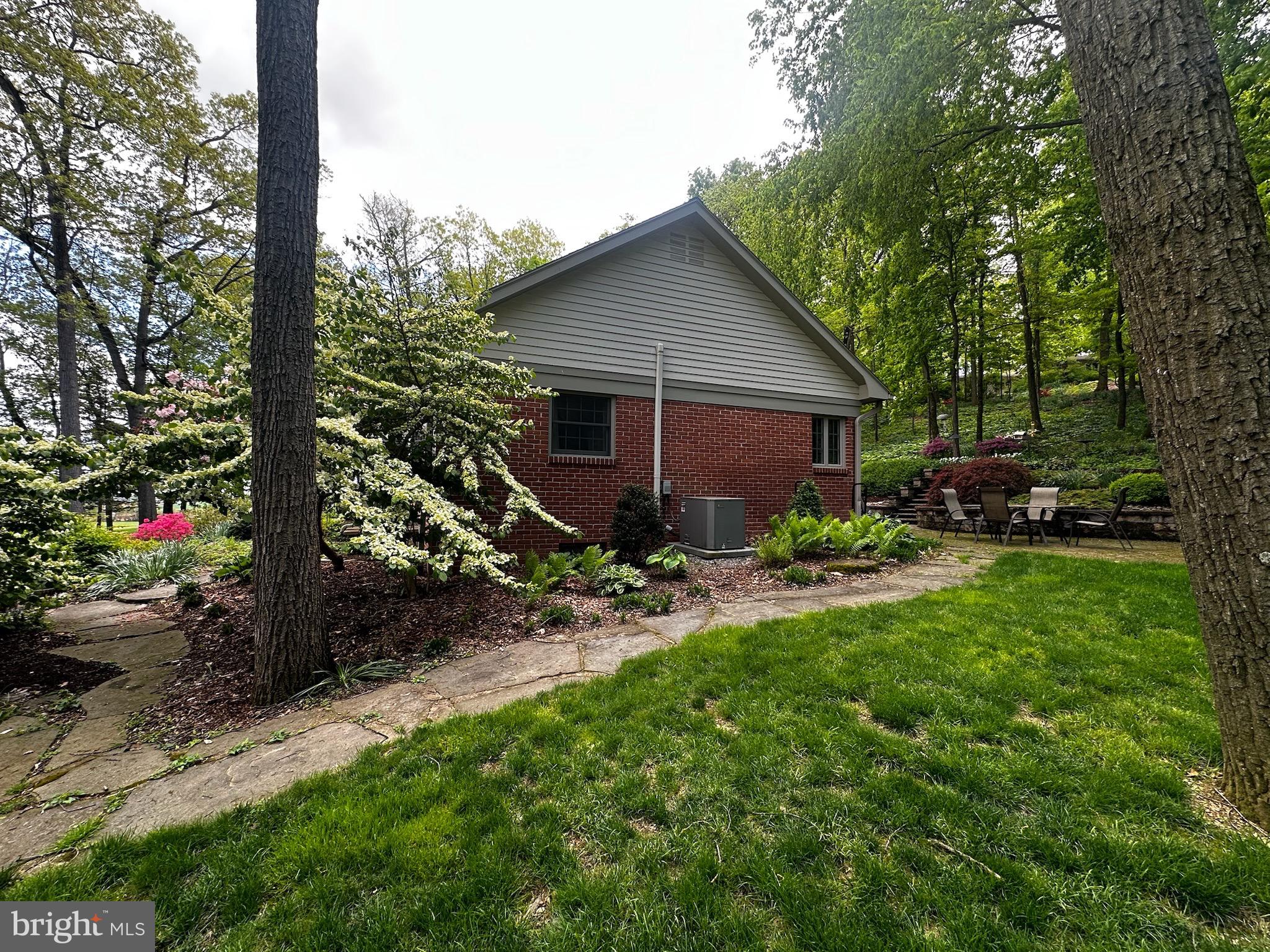 105 Northview Road Lititz, PA 17543 - Photo 9 of 38 a view of backyard with plants and outdoor seating