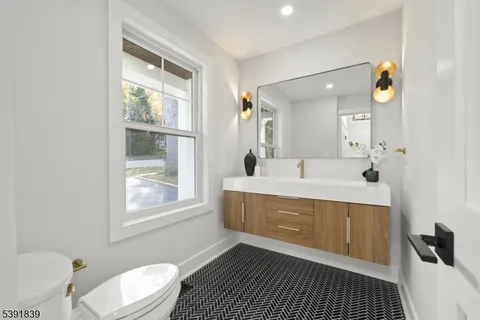 a view of a yard with wooden fence