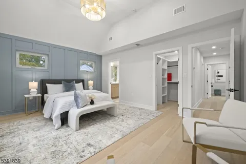 a house view with a sitting space and garden