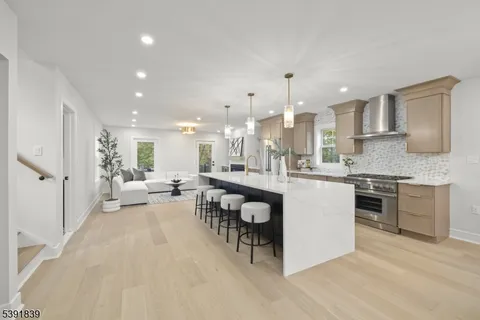 a bathroom with a bathtub shower sink and mirror