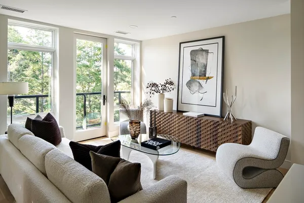 a living room with furniture and a large window