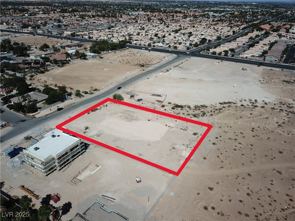 Lindell Road Las Vegas, NV 89118 - Photo 2 of 4 Aerial perspective of suburban area with property parcel outlined