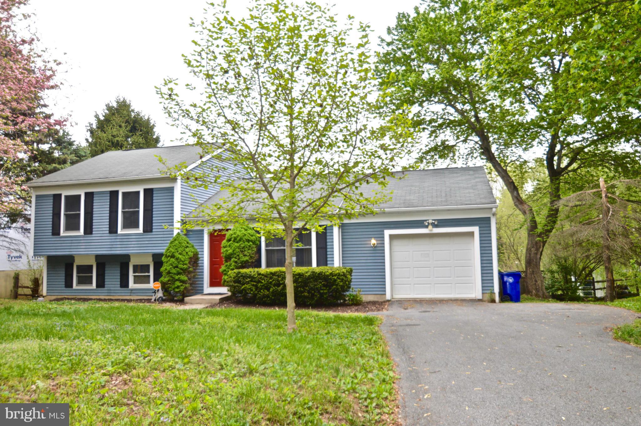 3827 Pippins Place Point of Rocks, MD 21777 - Photo 2 of 22 a front view of a house with a garden and trees