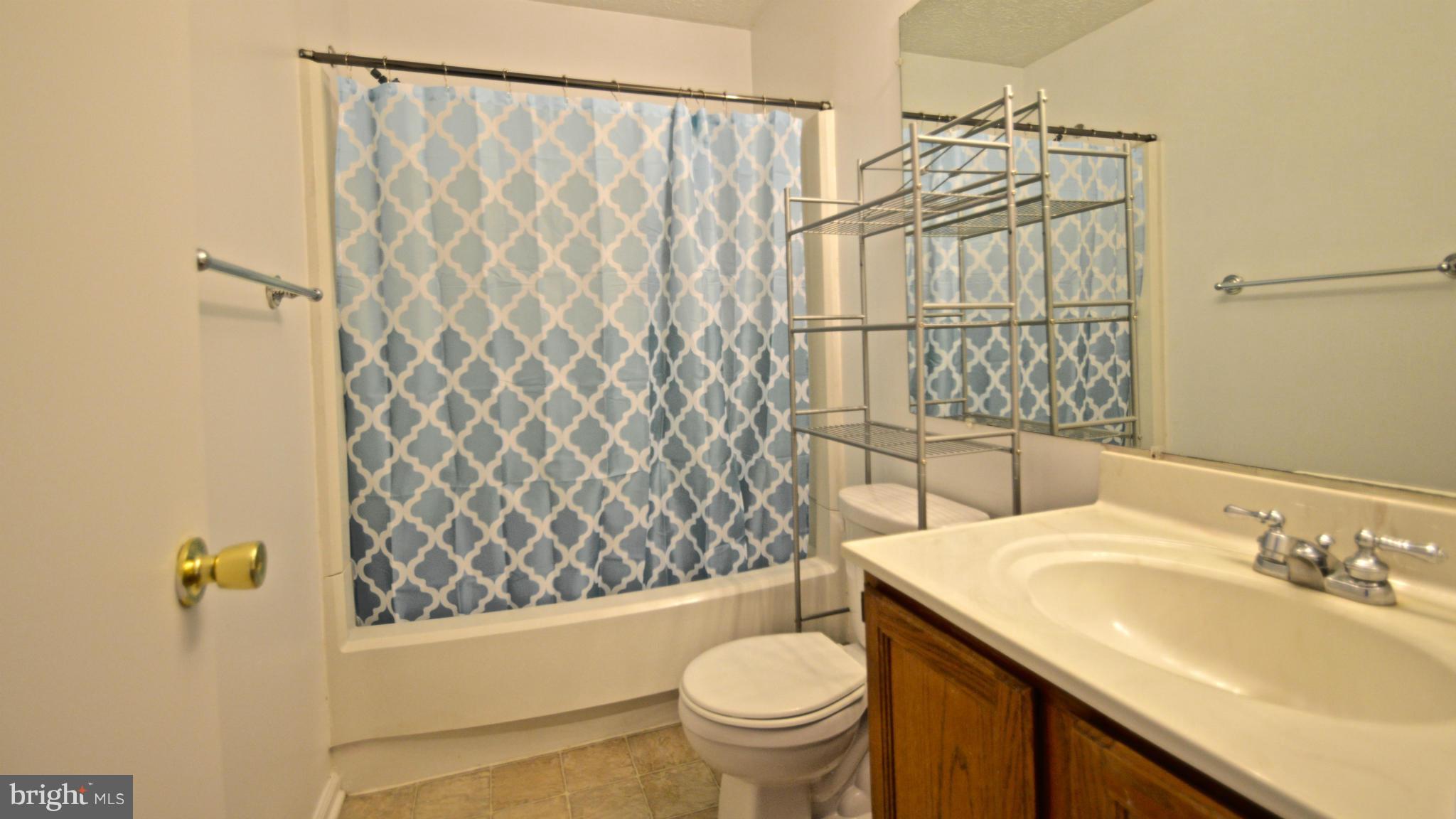 3827 Pippins Place Point of Rocks, MD 21777 - Photo 11 of 22 a bathroom with a granite countertop sink toilet and shower