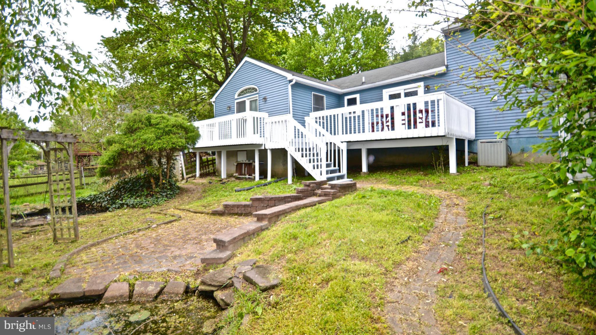 3827 Pippins Place Point of Rocks, MD 21777 - Photo 19 of 22 a front view of a house with garden