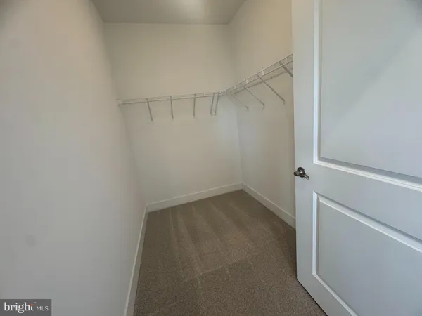 a view of an empty walk in closet