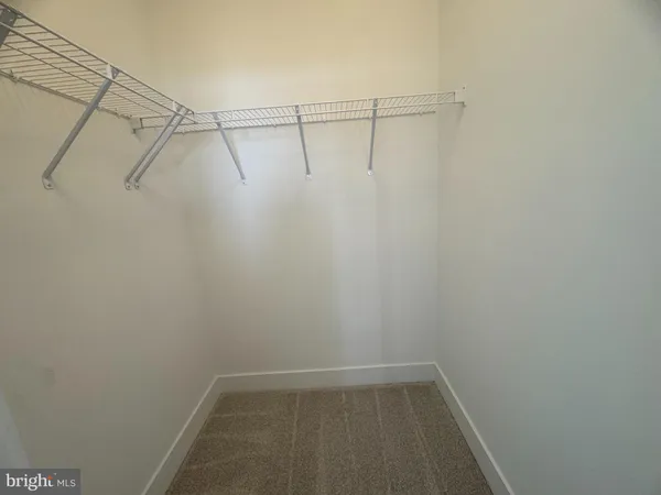 a view of a room with racks on the wall