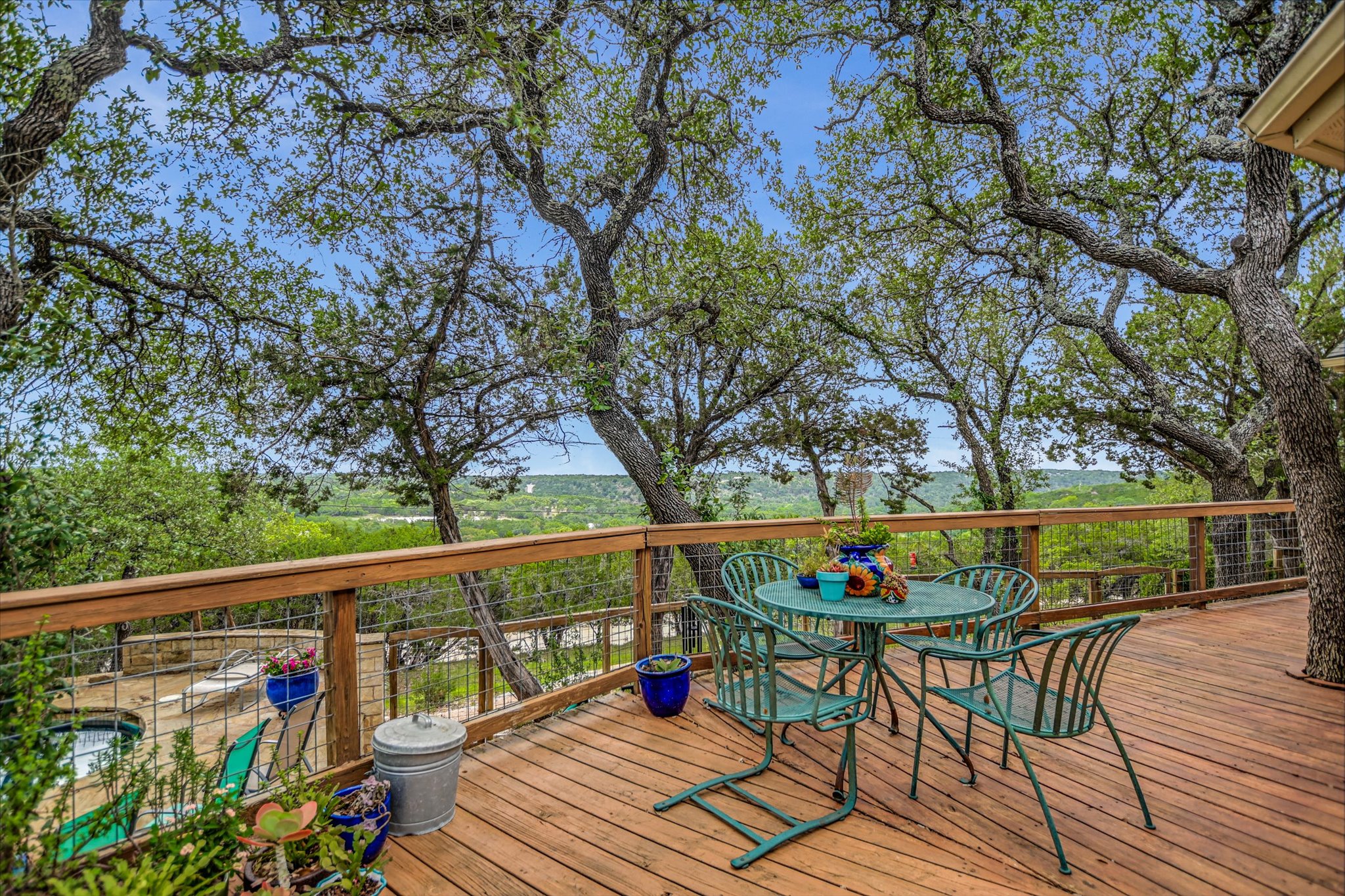 590 Rancho Grande Drive Wimberley, TX 78676 - Photo 3 of 30 a view of balcony with wooden floor and outdoor seating