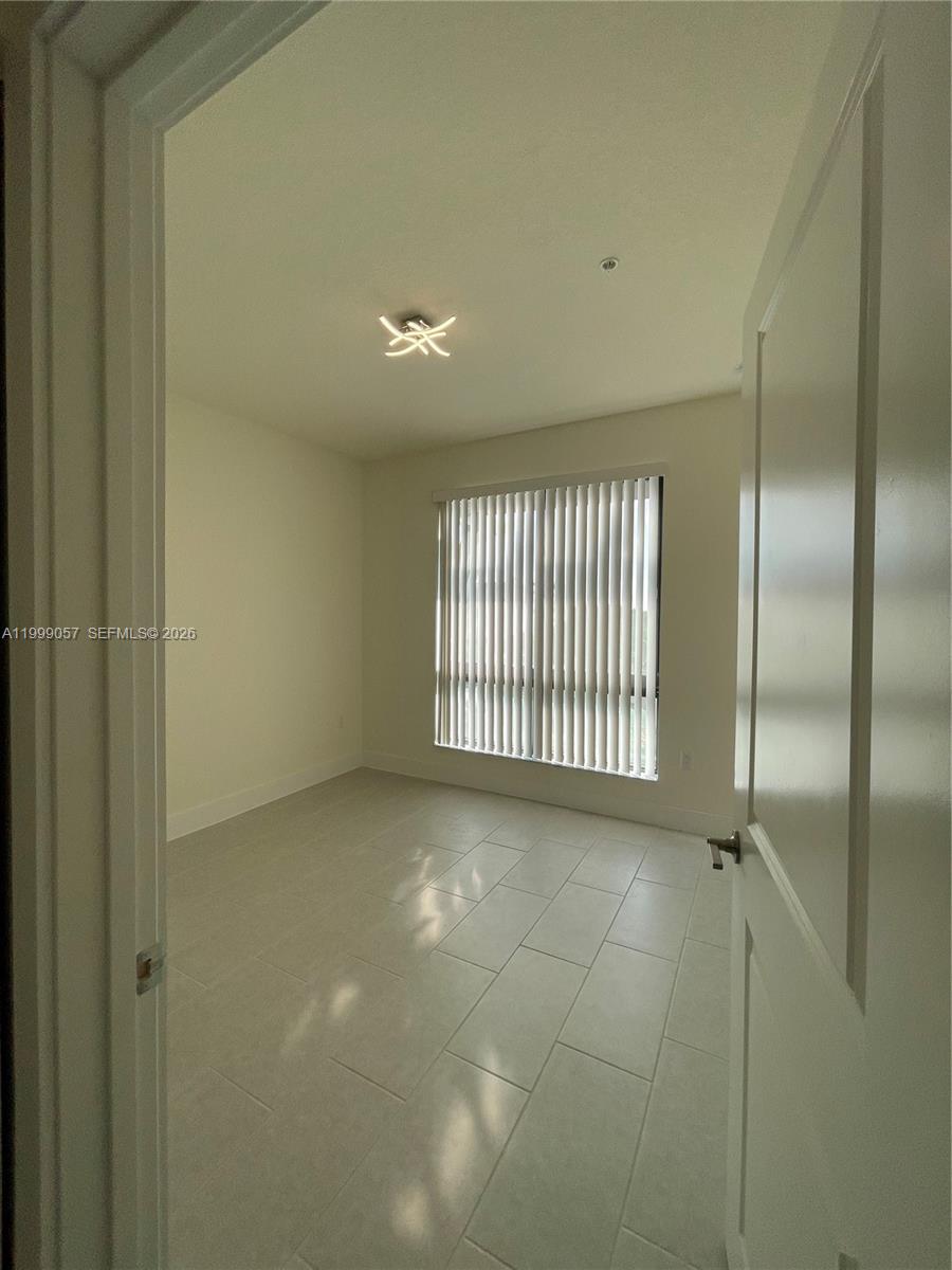 8167 Northwest 41st Street, Unit E409 Doral, FL 33166 - Photo 13 of 30 a view of a livingroom with a staircase