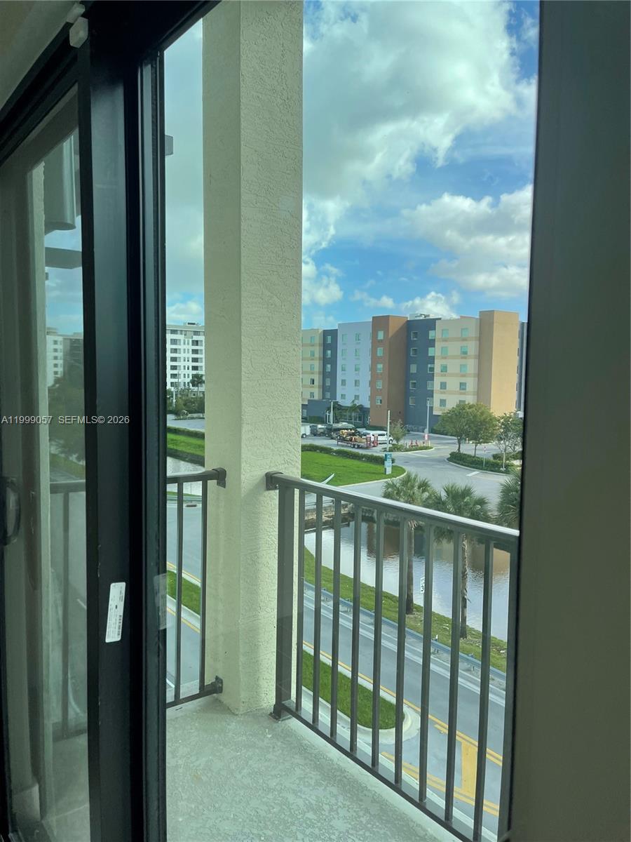 8167 Northwest 41st Street, Unit E409 Doral, FL 33166 - Photo 14 of 30 a view of a balcony with an outdoor space