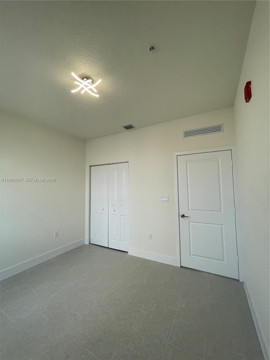 8167 Northwest 41st Street, Unit E409 Doral, FL 33166 - Photo 23 of 30 a view of empty room