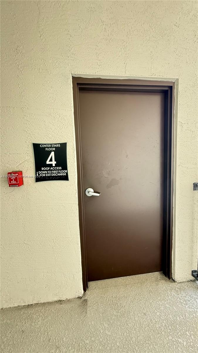8167 Northwest 41st Street, Unit E409 Doral, FL 33166 - Photo 26 of 30 a view of a hallway