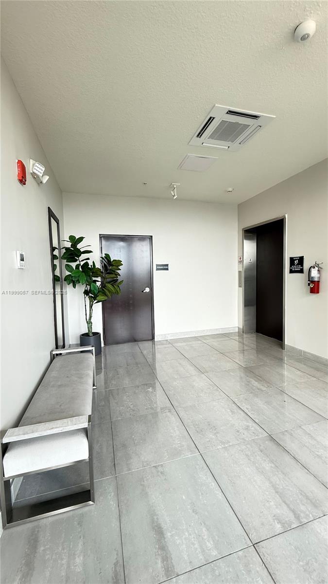 8167 Northwest 41st Street, Unit E409 Doral, FL 33166 - Photo 27 of 30 a view interior of a house and livingroom with furniture