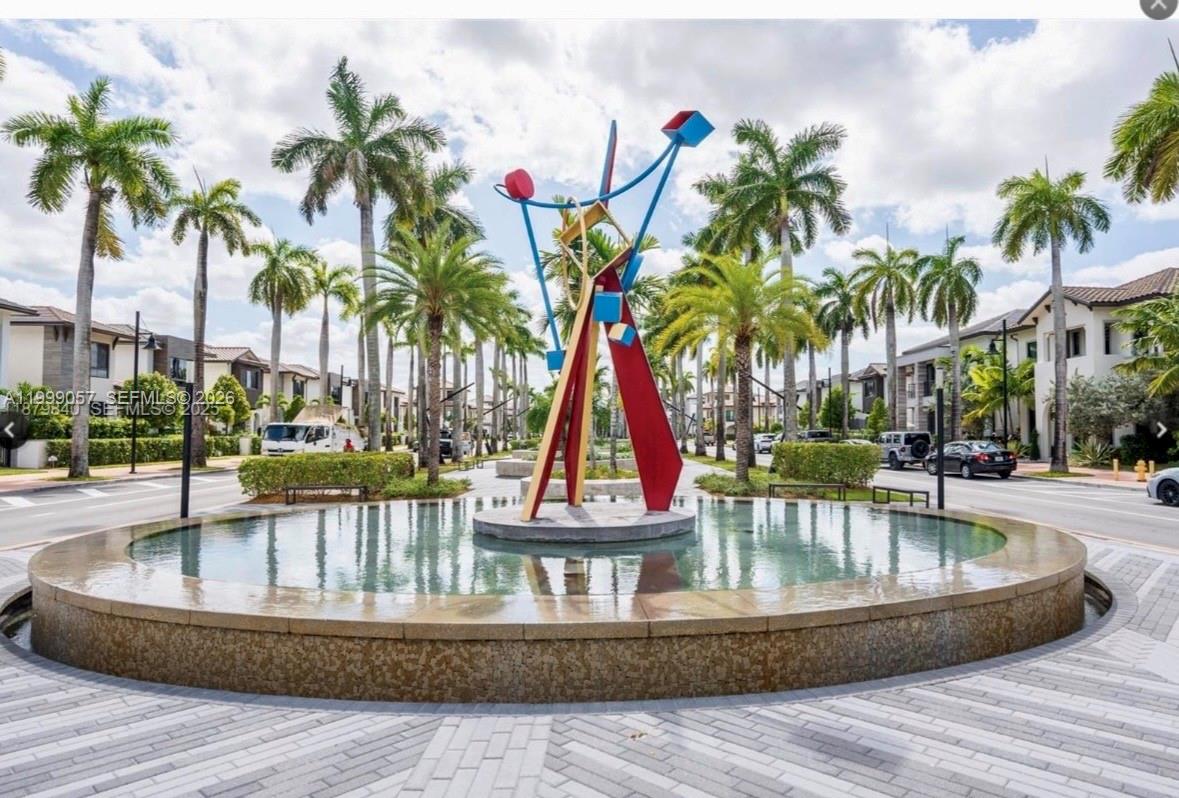 8167 Northwest 41st Street, Unit E409 Doral, FL 33166 - Photo 31 of 34 a view of outdoor space with swimming pool