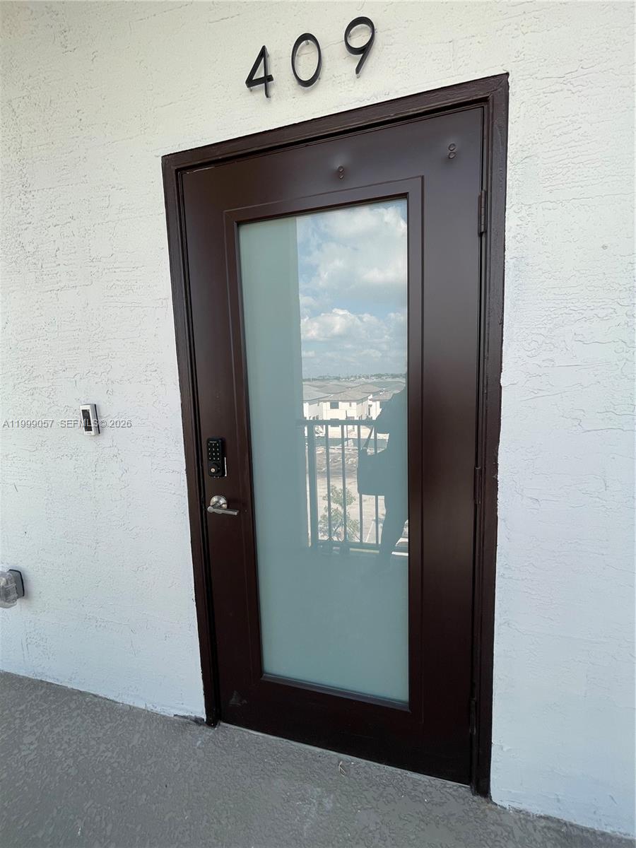 8167 Northwest 41st Street, Unit E409 Doral, FL 33166 - Photo 5 of 30 a view of an entryway