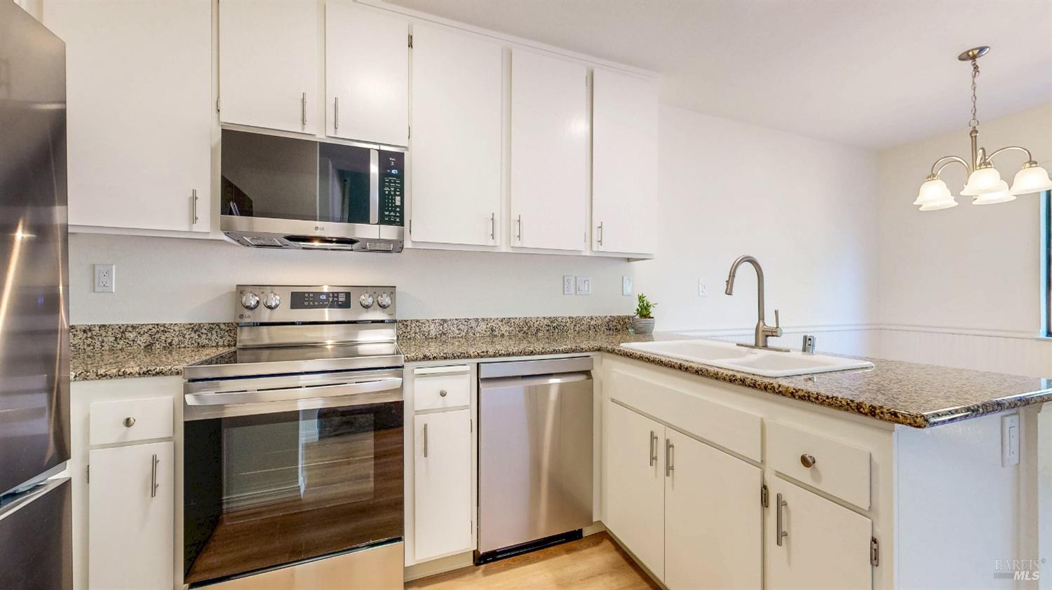 158 North Dutton Avenue Santa Rosa, CA 95401 - Photo 17 of 50 a kitchen with stainless steel appliances granite countertop a sink and a microwave