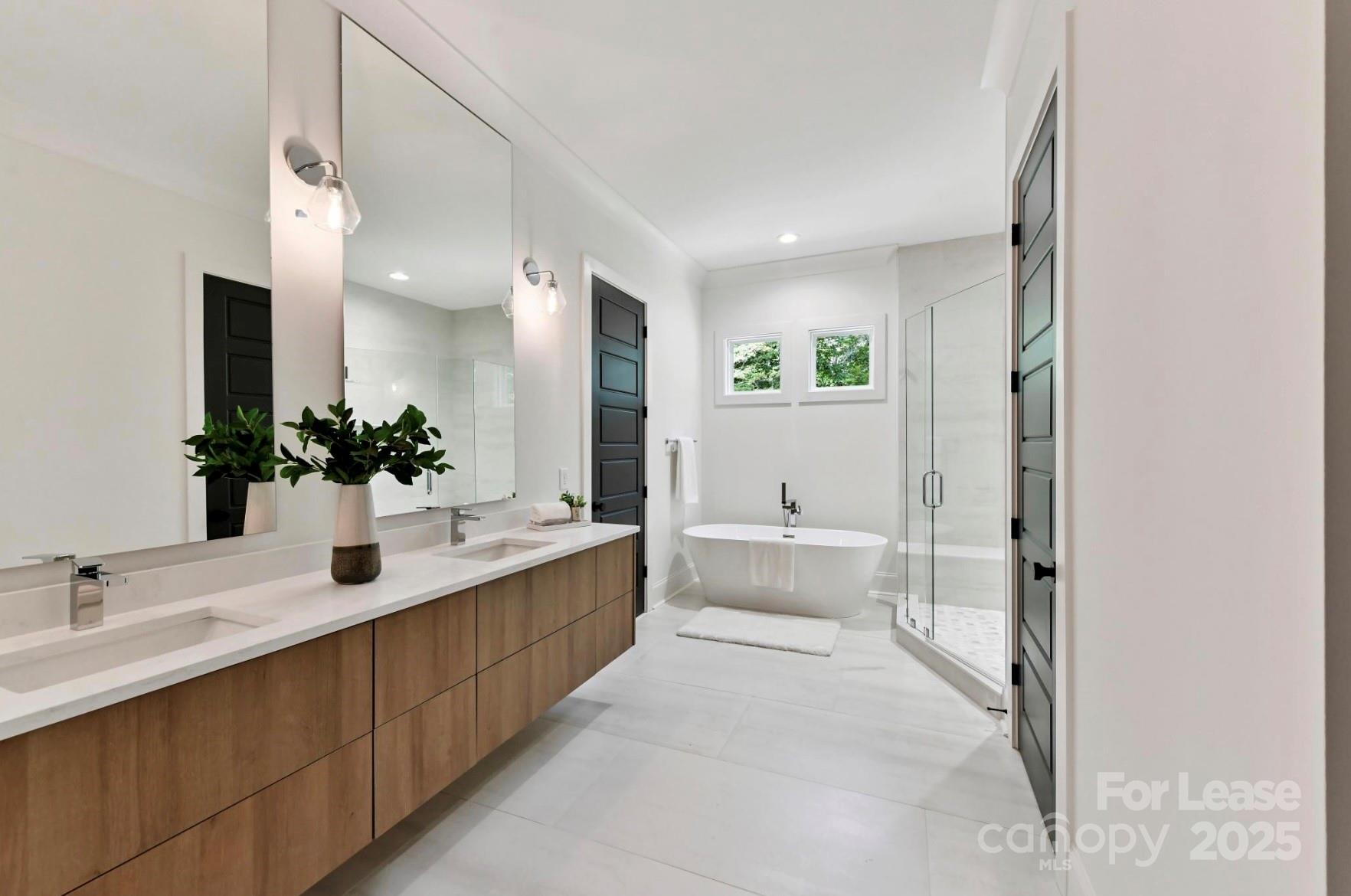 3830 Mill Run Terrell, NC 28682 - Photo 14 of 32 a bathroom with a double vanity sink mirror and bathtub