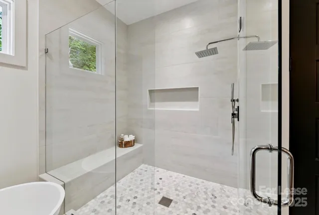 a bathroom with a shower and a sink