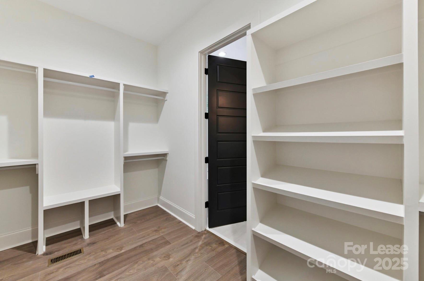 3830 Mill Run Terrell, NC 28682 - Photo 16 of 32 a view of walk in closet with empty racks