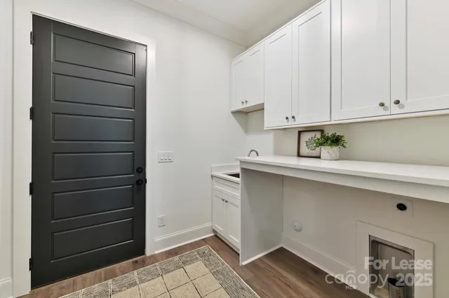 a kitchen with a white cabinets and a stove