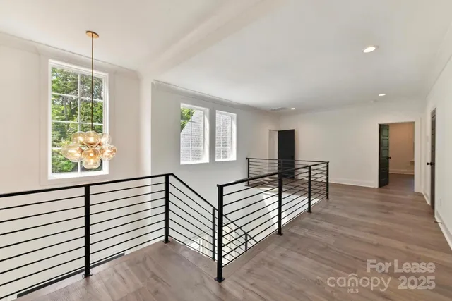 a view of entryway with wooden floor