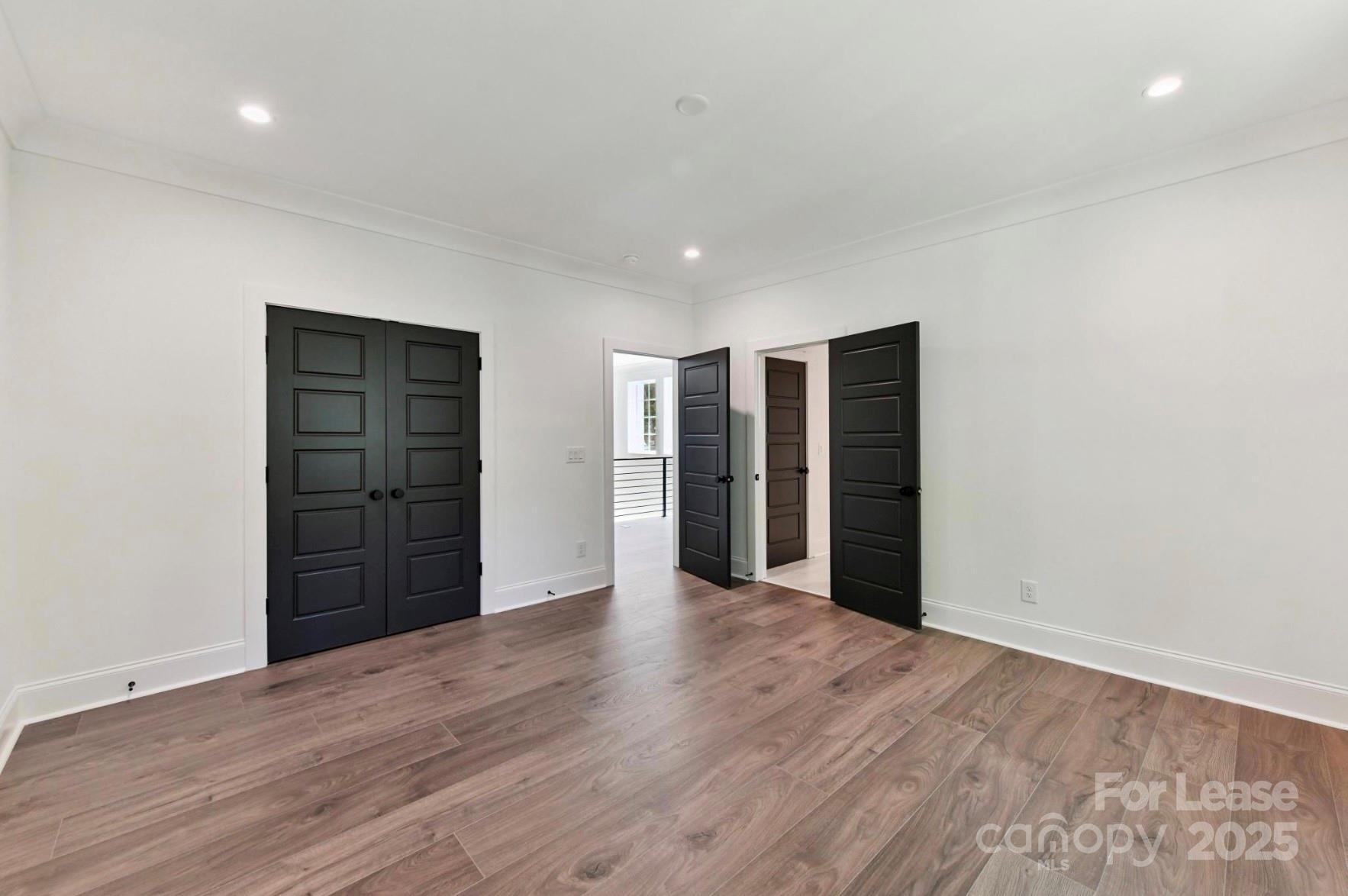 3830 Mill Run Terrell, NC 28682 - Photo 26 of 32 a view of an empty room with closet and wooden floor