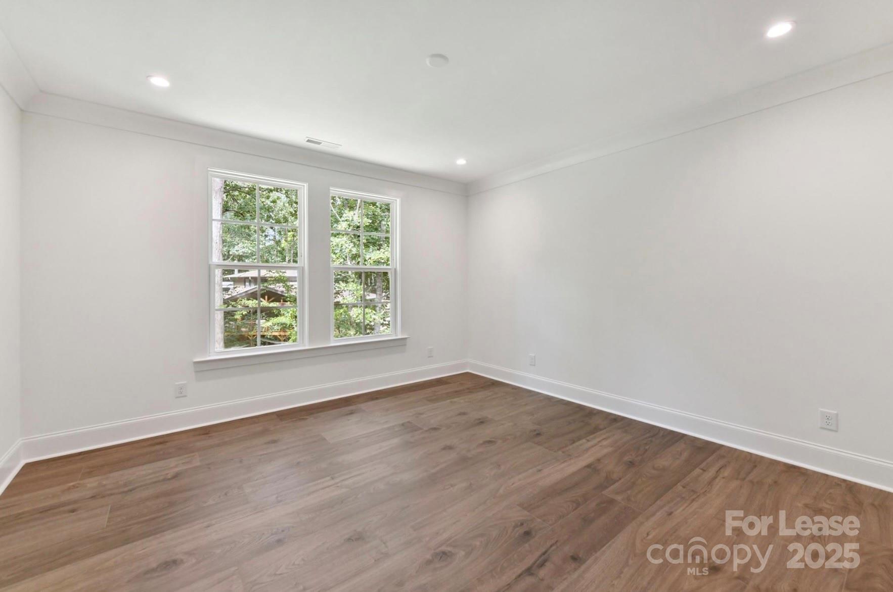 3830 Mill Run Terrell, NC 28682 - Photo 27 of 32 an empty room with wooden floor and windows