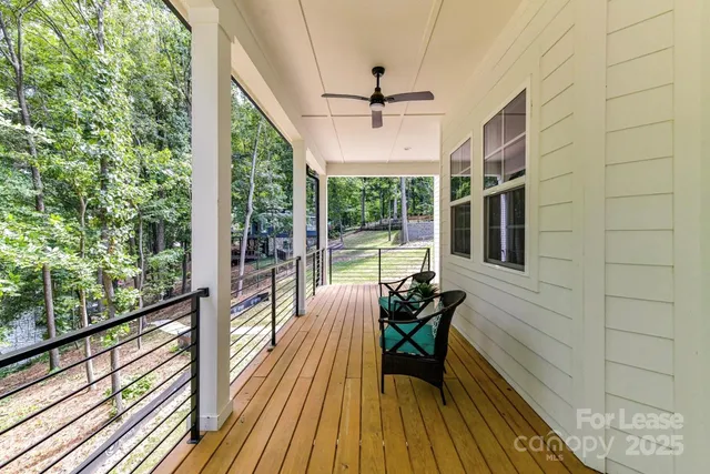 a view of a balcony with chairs