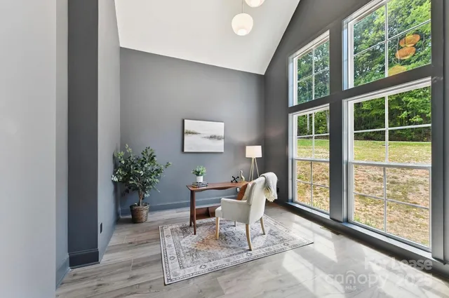 a living room with furniture and windows
