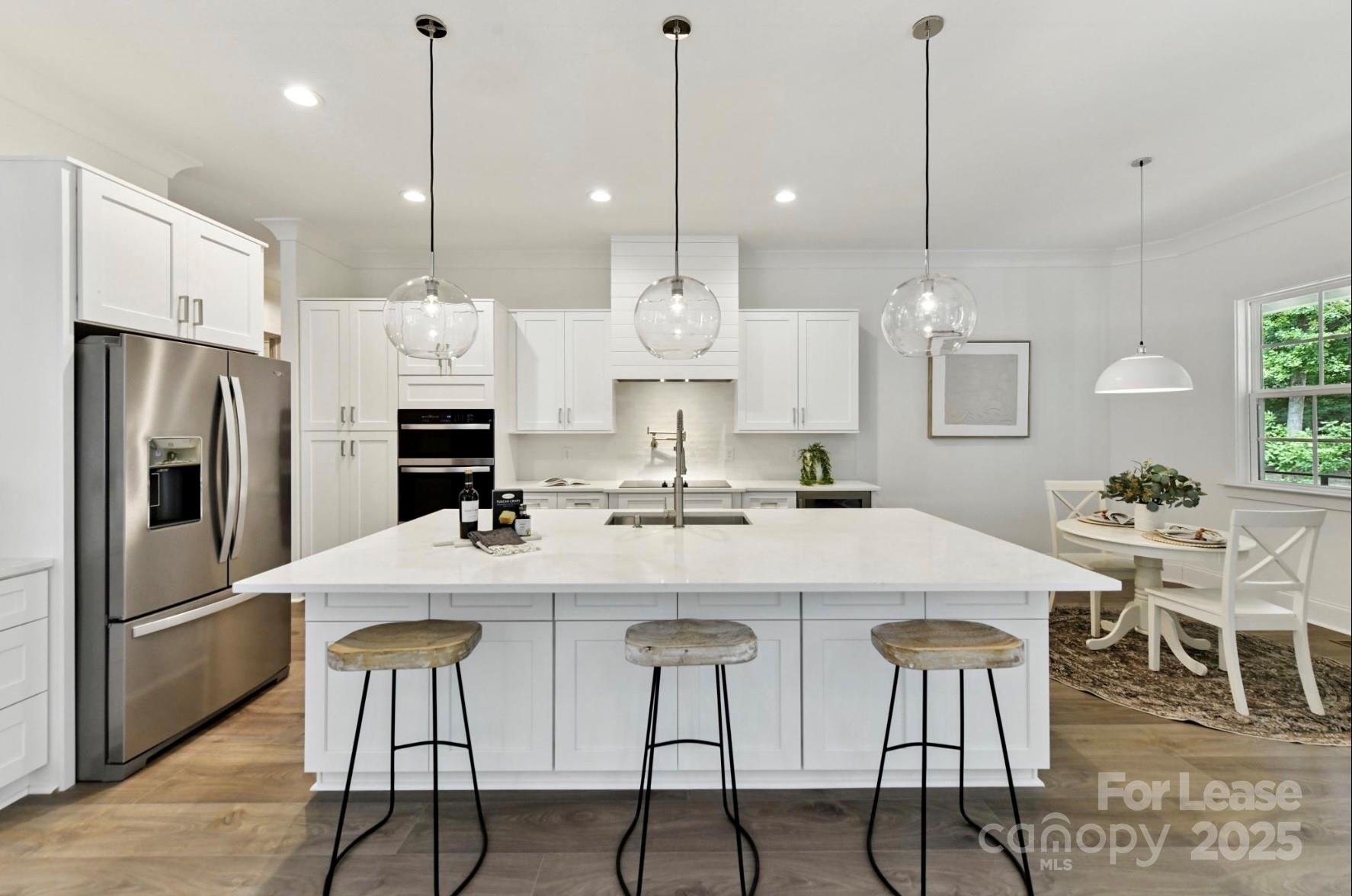 3830 Mill Run Terrell, NC 28682 - Photo 7 of 32 a kitchen with stainless steel appliances kitchen island a table and chairs
