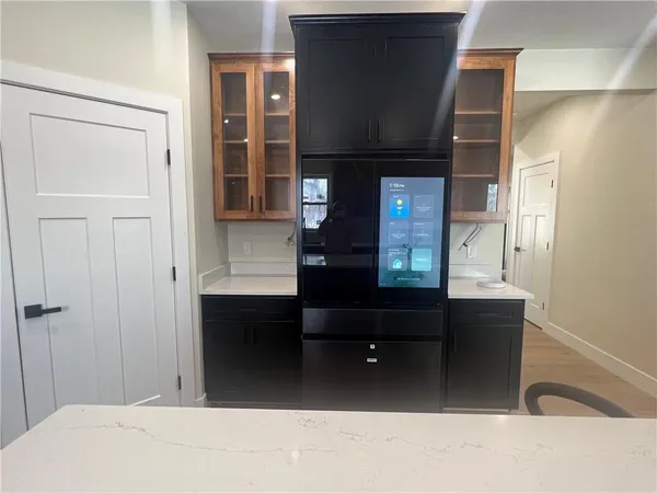 a living room with a bed and a dresser