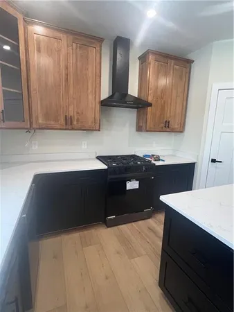 a kitchen with a sink and a stove top oven