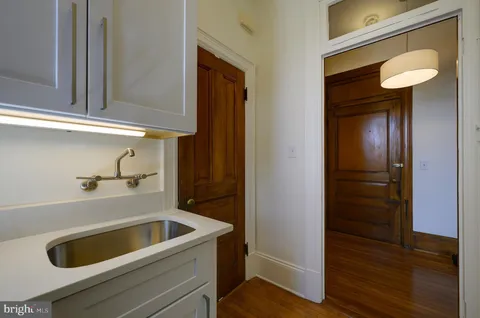 a kitchen with a refrigerator and cabinets