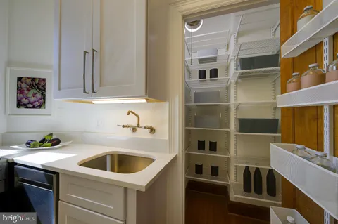 a kitchen with a sink and a refrigerator