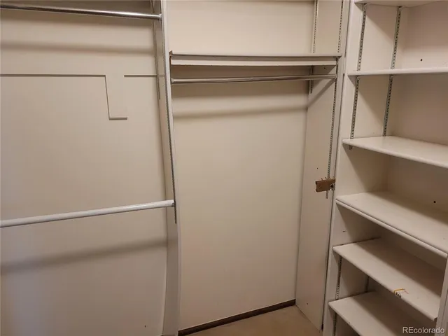 a view of storage and utility room with racks on the wall