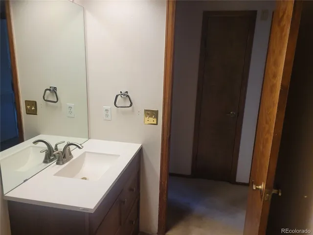 a bathroom with a sink and mirror