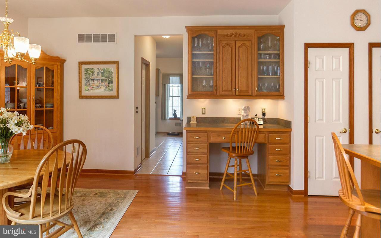 20000 Gunpowder Road Manchester, MD 21102 - Photo 12 of 30 a dining room with furniture a chandelier and wooden floor