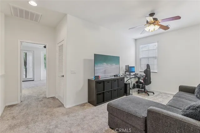 a bedroom with a bed and a desk