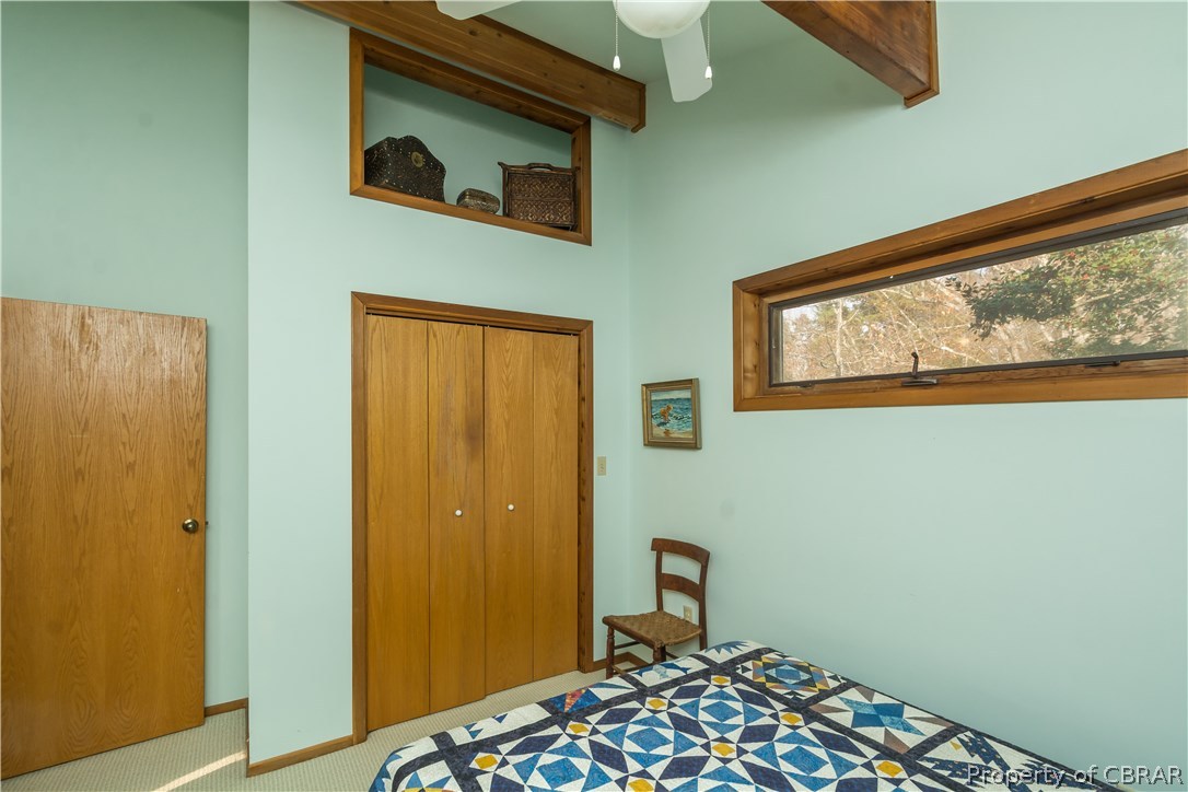 297 Cove Colony Road Lancaster, VA 22503 - Photo 29 of 50 a bedroom with a bed and a window