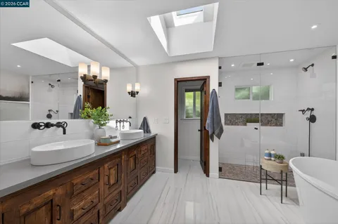 a view of a bedroom with furniture and windows