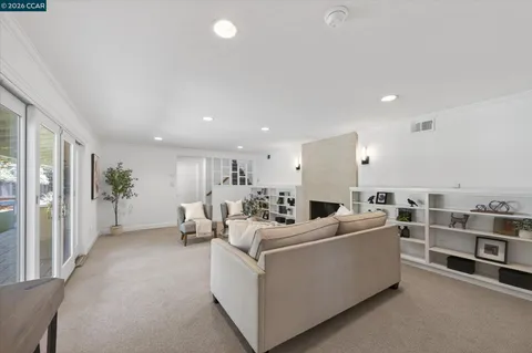 a bed room with a bed and a chair