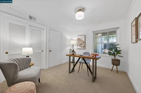 an aerial view of a house with a yard and lake view