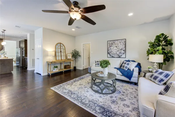 a spacious bedroom with a bed and a cabinets