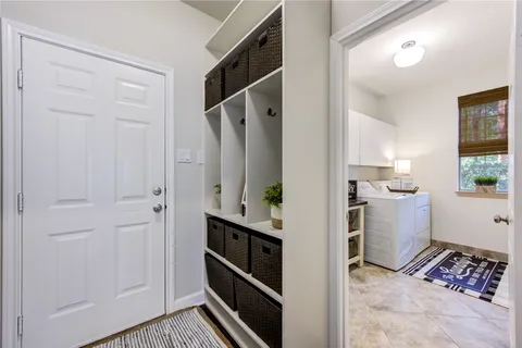 a bedroom with furniture and a window