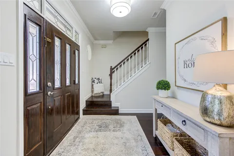 an aerial view of residential house with outdoor space and trees all around