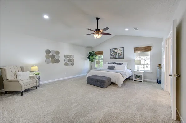 an aerial view of a house with a yard and garden