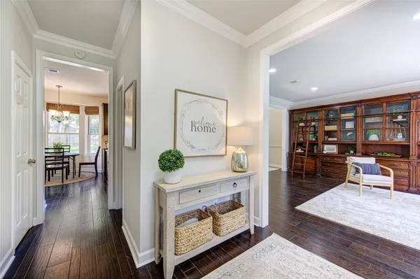 a living room with furniture and large window