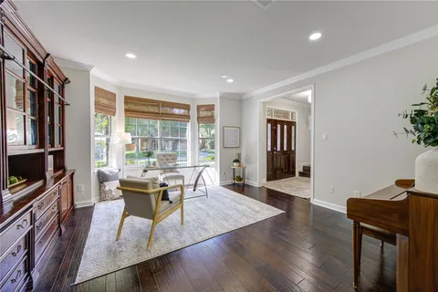 a view of a dining room with furniture and a potted plant