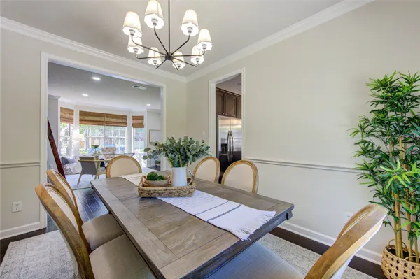 a kitchen with kitchen island granite countertop a sink a counter space appliances and cabinets