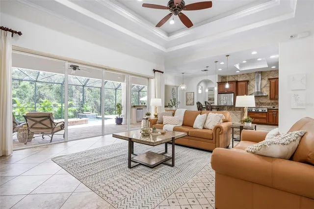 a view of a dining room with furniture and chandelier